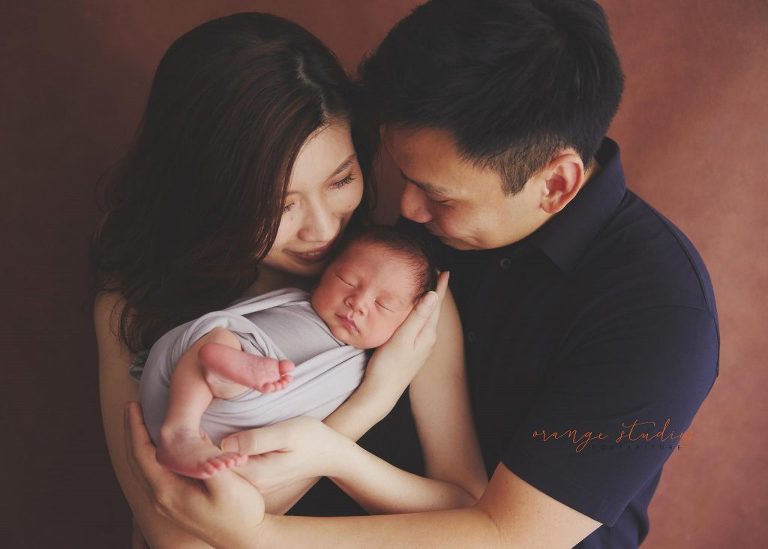 7 days old baby boy newborn portraits with parents in singapore home