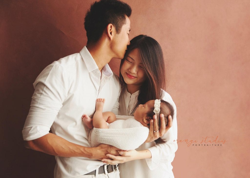 6 weeks old baby girl newborn portraits with parents in singapore studio