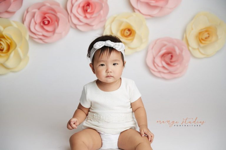 one year old baby girl floral cake smash portraits in singapore studio