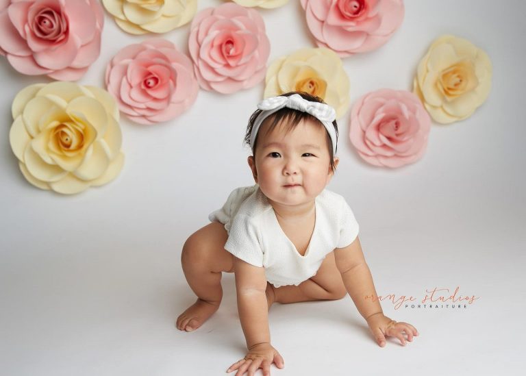 one year old baby girl floral cake smash portraits in singapore studio