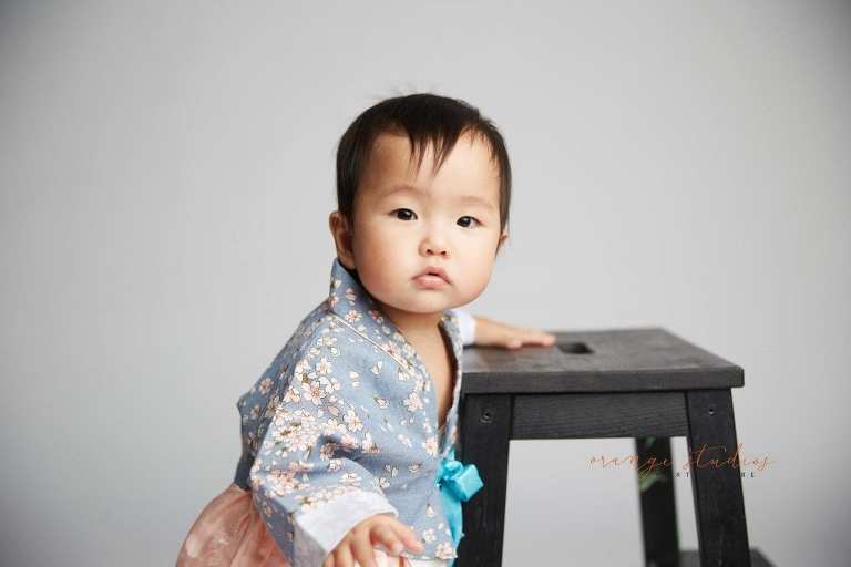 one year old baby girl in hanbok in singapore studio
