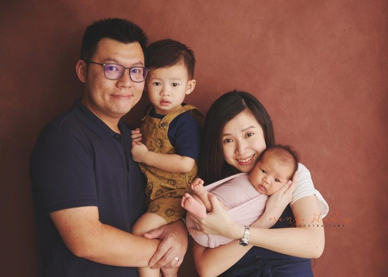 4 weeks old baby girl with family newborn portraits in singapore studio