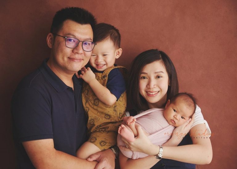 4 weeks old baby girl with family newborn portraits in singapore studio