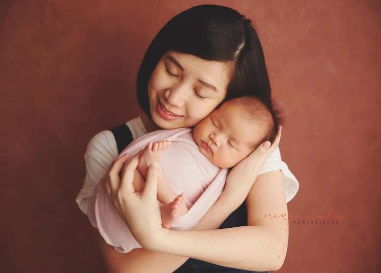 4 weeks old baby girl with mum newborn portraits in singapore studio
