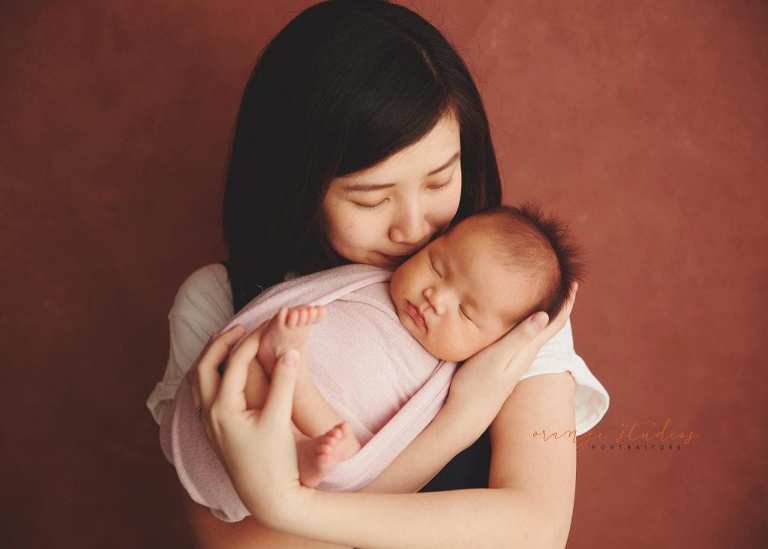 4 weeks old baby girl with mum newborn portraits in singapore studio