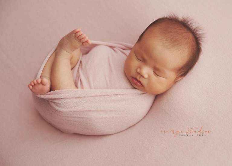 4 weeks old baby girl newborn portraits in singapore studio