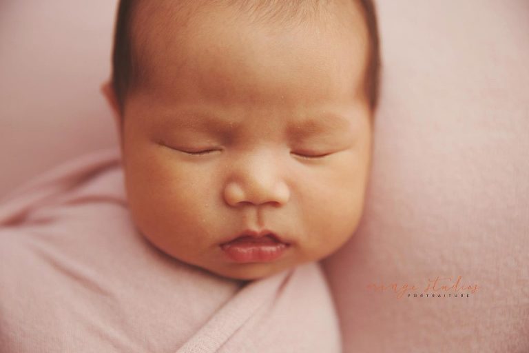 4 weeks old baby girl newborn portraits in singapore studio