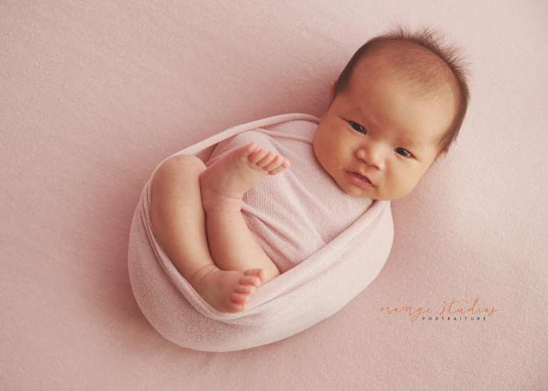 awake 4 weeks old baby girl newborn portraits in singapore studio