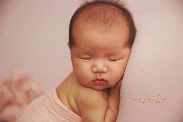 4 weeks old baby girl newborn portraits in singapore studio