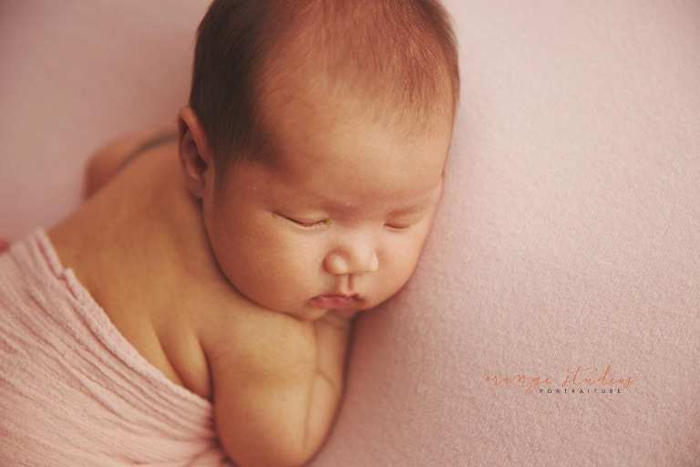 4 weeks old baby girl newborn portraits in singapore studio
