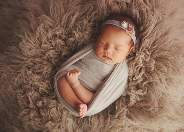 4 weeks old baby girl newborn portraits in singapore studio