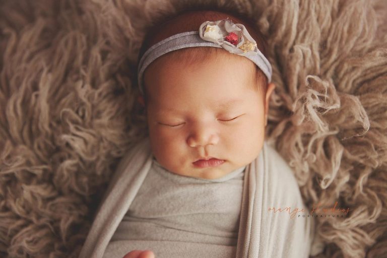 4 weeks old baby girl newborn portraits in singapore studio