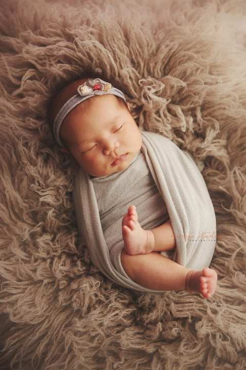 4 weeks old baby girl newborn portraits in singapore studio