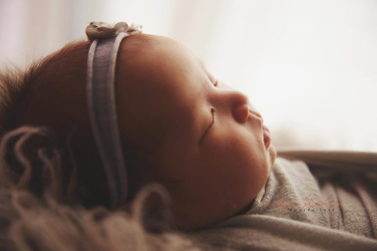 4 weeks old baby girl newborn portraits in singapore studio
