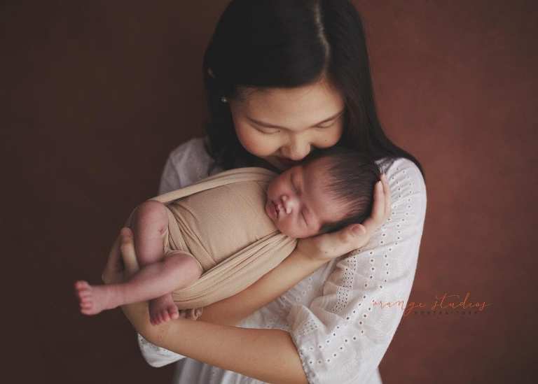 2 weeks old baby girl with mum newborn portraits in singapore studio