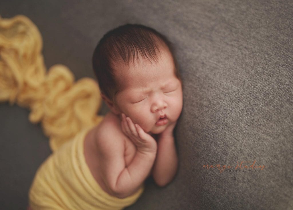 2 weeks old cute baby girl newborn portraits in singapore studio