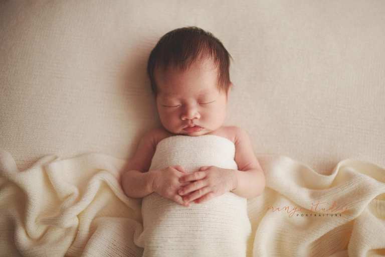2 weeks old sleeping baby girl newborn portraits in singapore studio