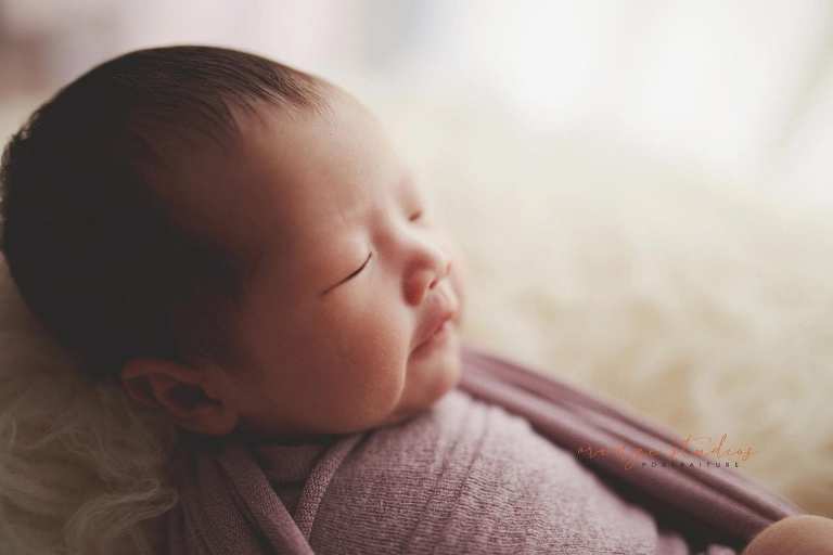 2 weeks old baby girl newborn portraits in singapore studio
