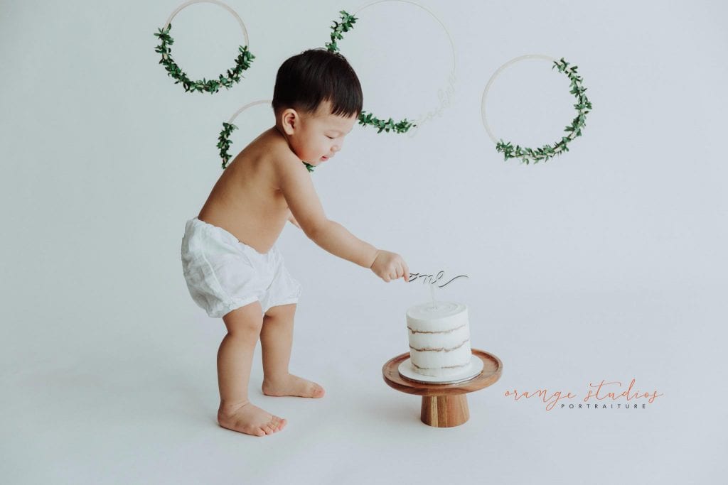 1 year old baby boy cake smash portraits in singapore studio