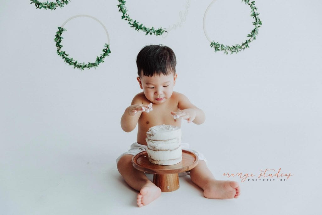 1 year old baby boy cake smash portraits in singapore studio