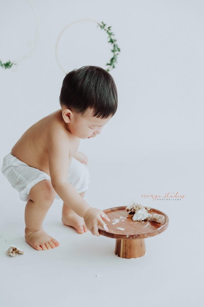 1 year old baby boy cake smash portraits in singapore studio