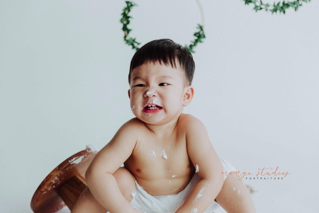 1 year old baby boy cake smash portraits in singapore studio