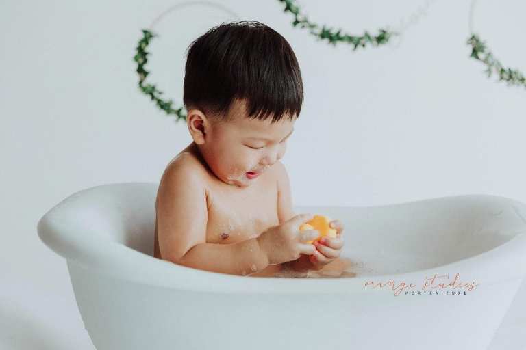 1 year old baby boy bubble bath portraits in singapore studio