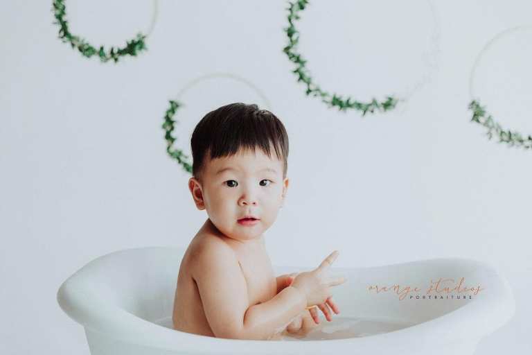 1 year old baby boy bubble bath portraits in singapore studio