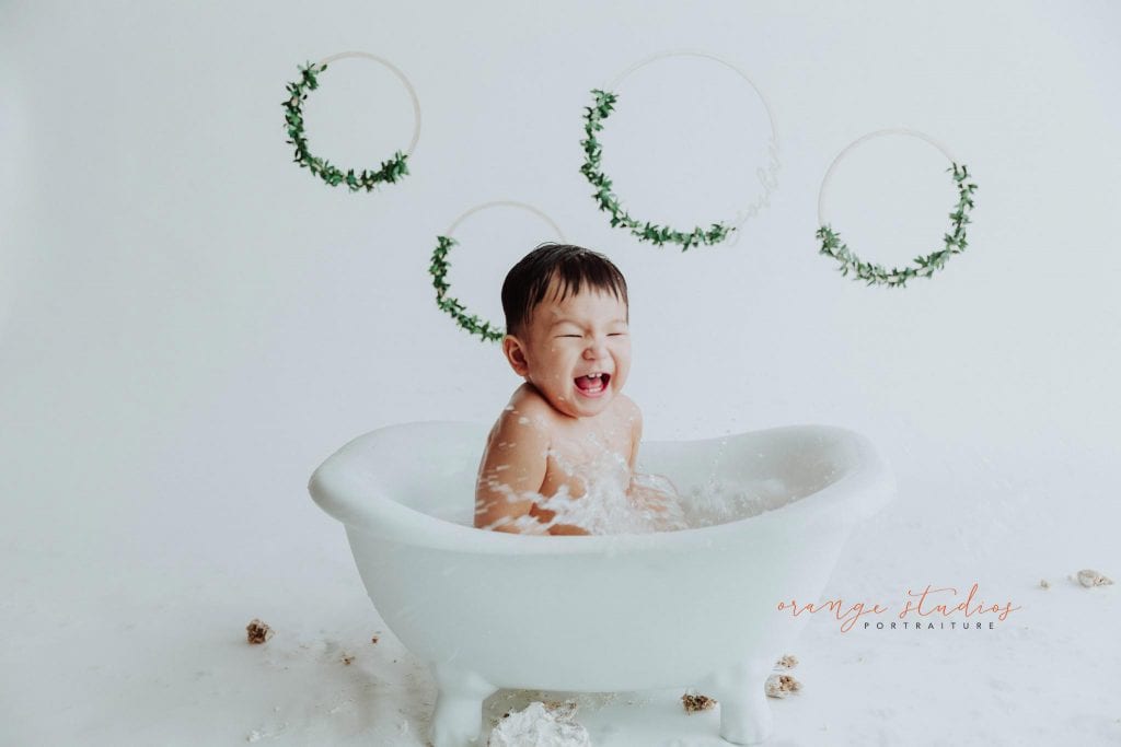 1 year old baby boy bubble bath portraits in singapore studio