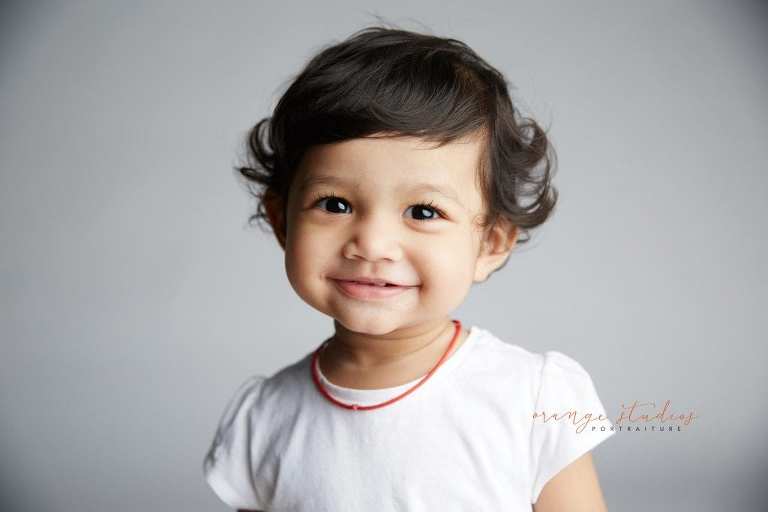 smiling baby portraits in singapore studio