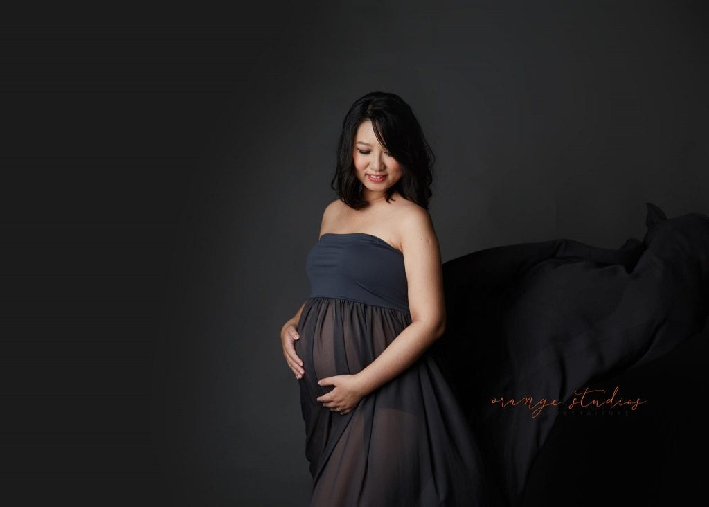 elegant and classy maternity portraits in singapore studio