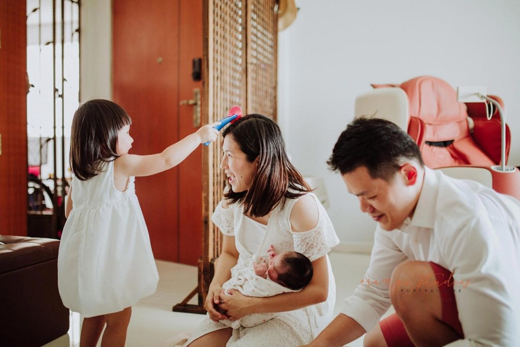 newborn baby with family fresh 48 photoshoot at home