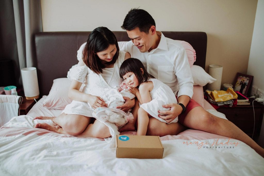 newborn baby with family fresh 48 photoshoot at home