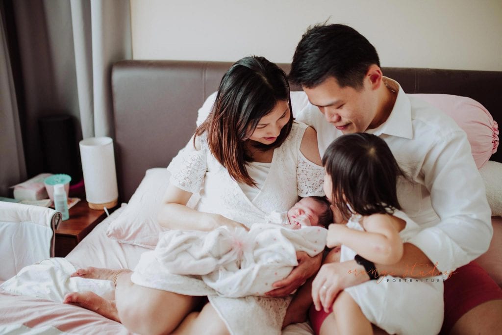 newborn baby with family fresh 48 photoshoot at home