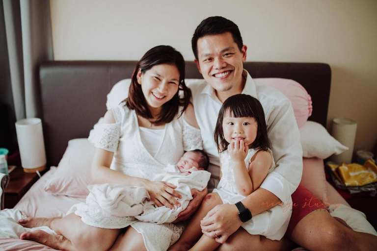 newborn baby with family fresh 48 photoshoot at home