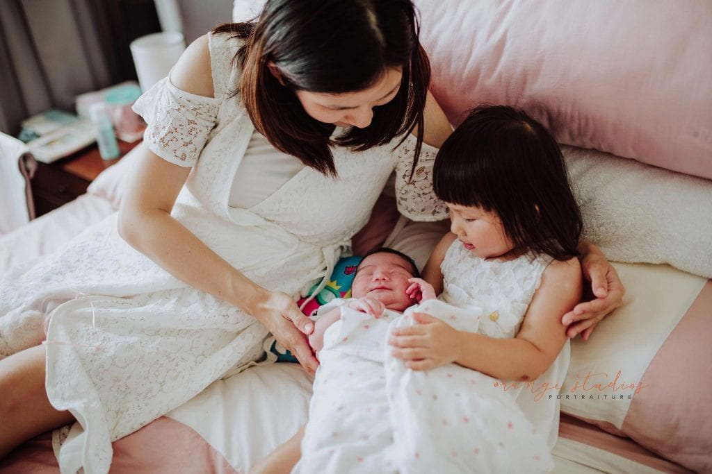 newborn baby with family fresh 48 photoshoot at home