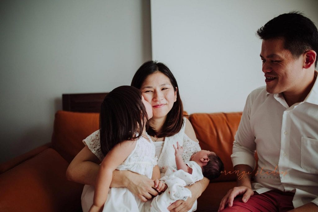 newborn baby with family fresh 48 photoshoot at home