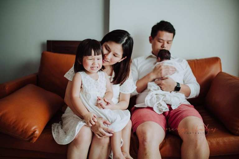 newborn baby with family fresh 48 photoshoot at home