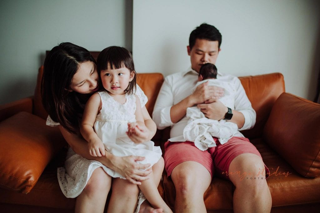 newborn baby with family fresh 48 photoshoot at home