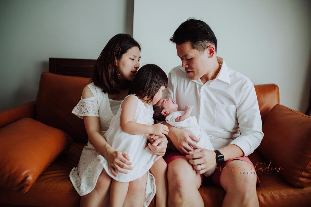 newborn baby with family fresh 48 photoshoot at home