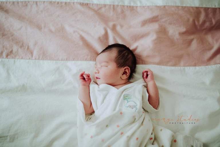 2 days old newborn baby girl during fresh 48 photoshoot at home
