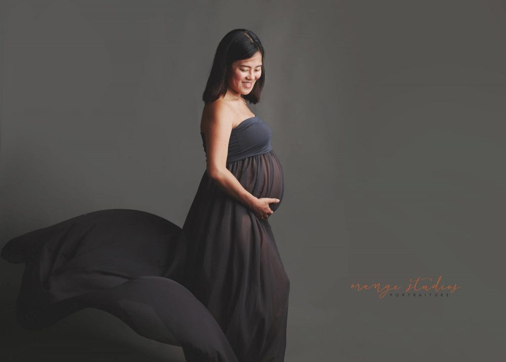 maternity portraits in long flowy gown in singapore studio