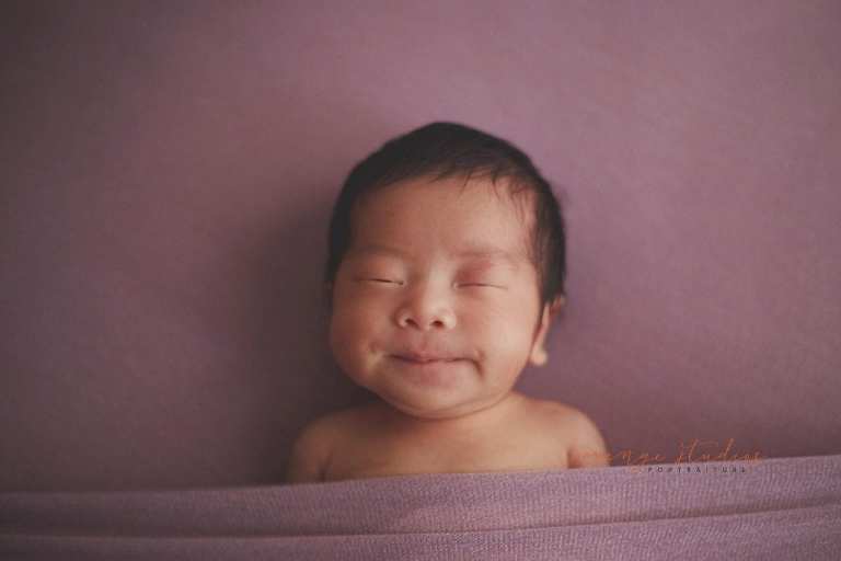 cute 11 days old newborn baby girl portraits in singapore home natural lighting
