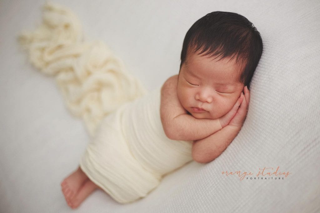 cute 11 days old newborn baby girl portraits in singapore home natural lighting