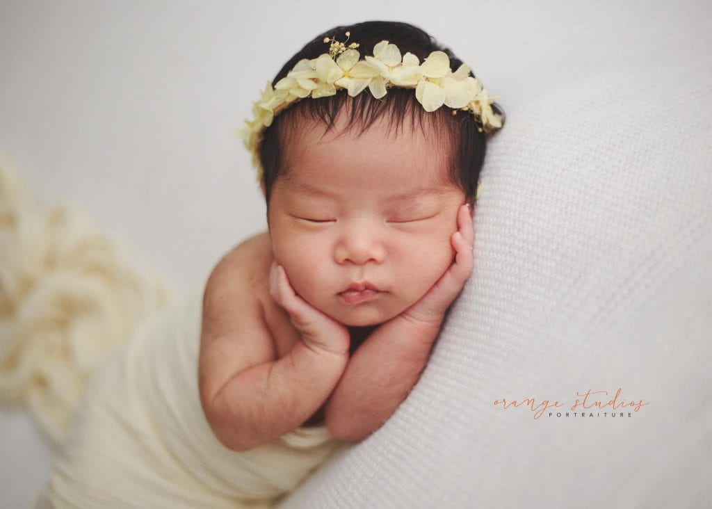 cute 11 days old newborn baby girl portraits in singapore home natural lighting