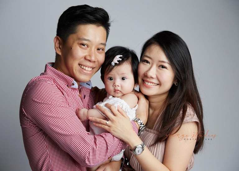 adorable baby girl and parents family portraits in singapore studio