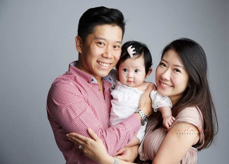 adorable baby girl and parents family portraits in singapore studio