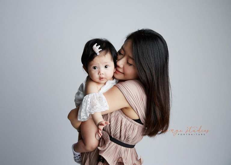 mum and adorable baby girl family portraits in singapore studio