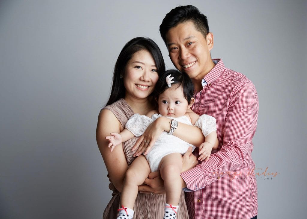 cute baby girl and parents family portraits in singapore studio