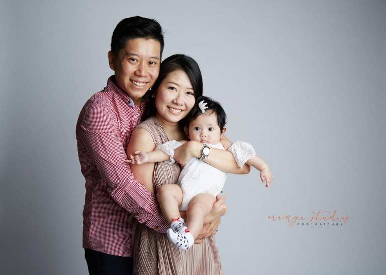 adorable baby girl and parents family portraits in singapore studio